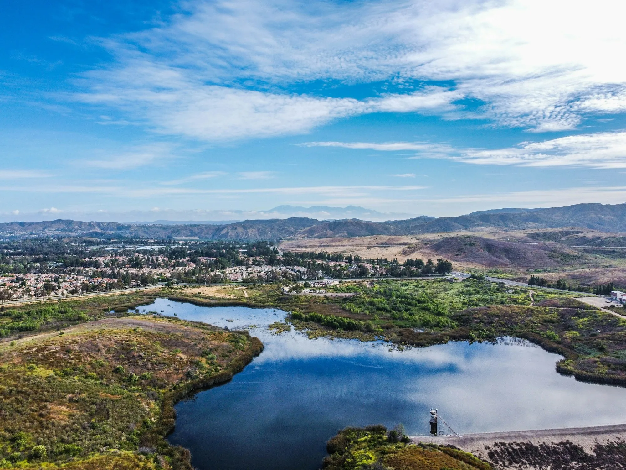 Water Filtration in Aliso Viejo & Surrounding South County Areas Aerial view of a lake, homes and rolling hills