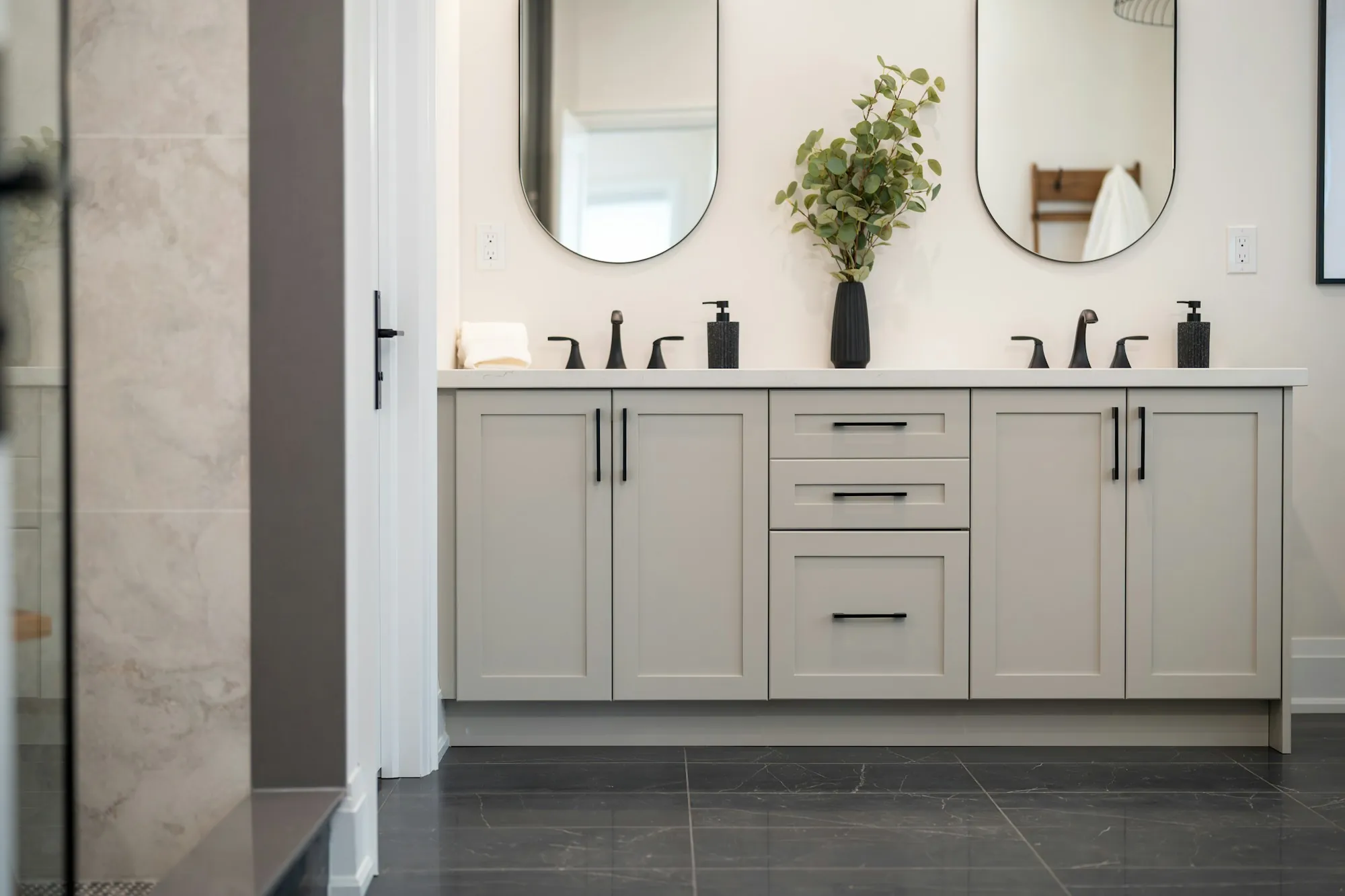 Water Softener Installation in Aliso Viejo, CA Modern bathroom vanity with two sinks and round mirrors