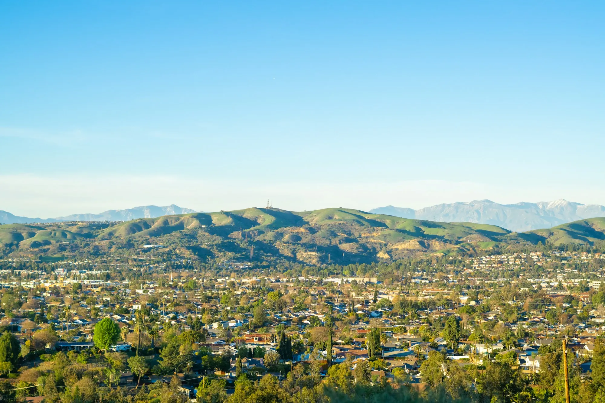 Find Out What Is Really in Your Water Green hills rising behind a sprawling suburban valley