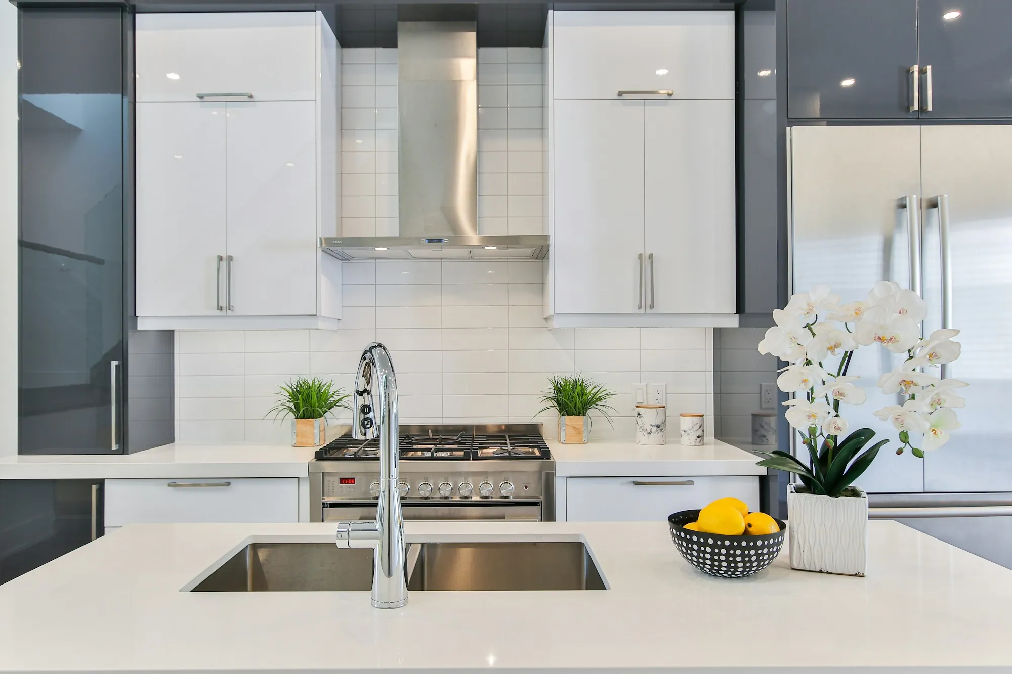Water Filtration in Aliso Viejo, CA, Done the Honest Way Bright modern kitchen with a stainless double sink and a chrome faucet