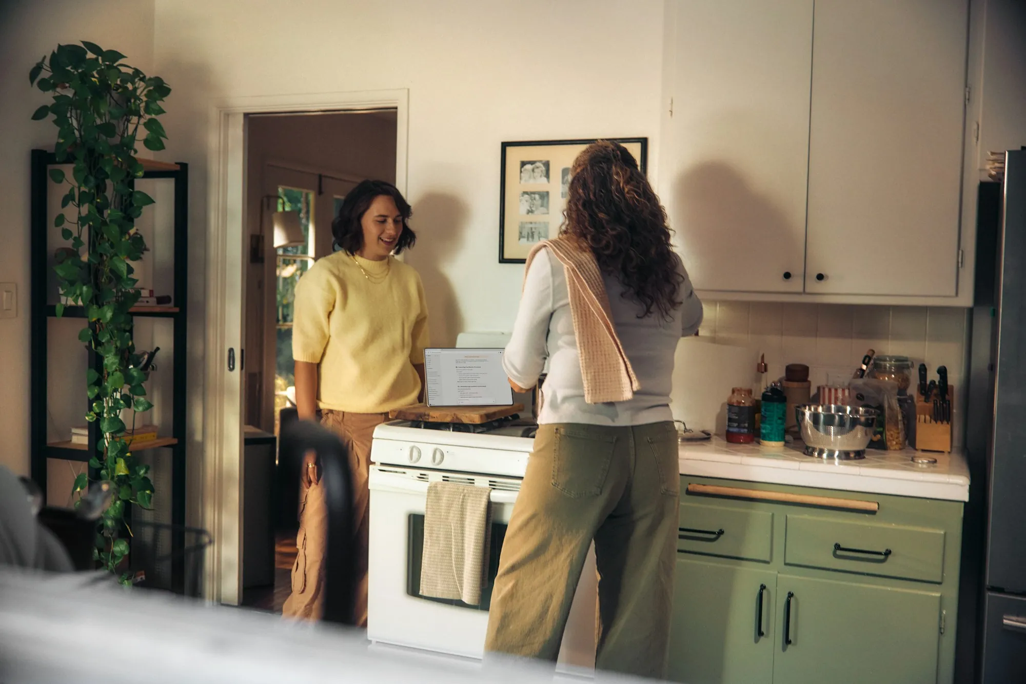 Local Roots in South Orange County Water Two women talking in a home kitchen
