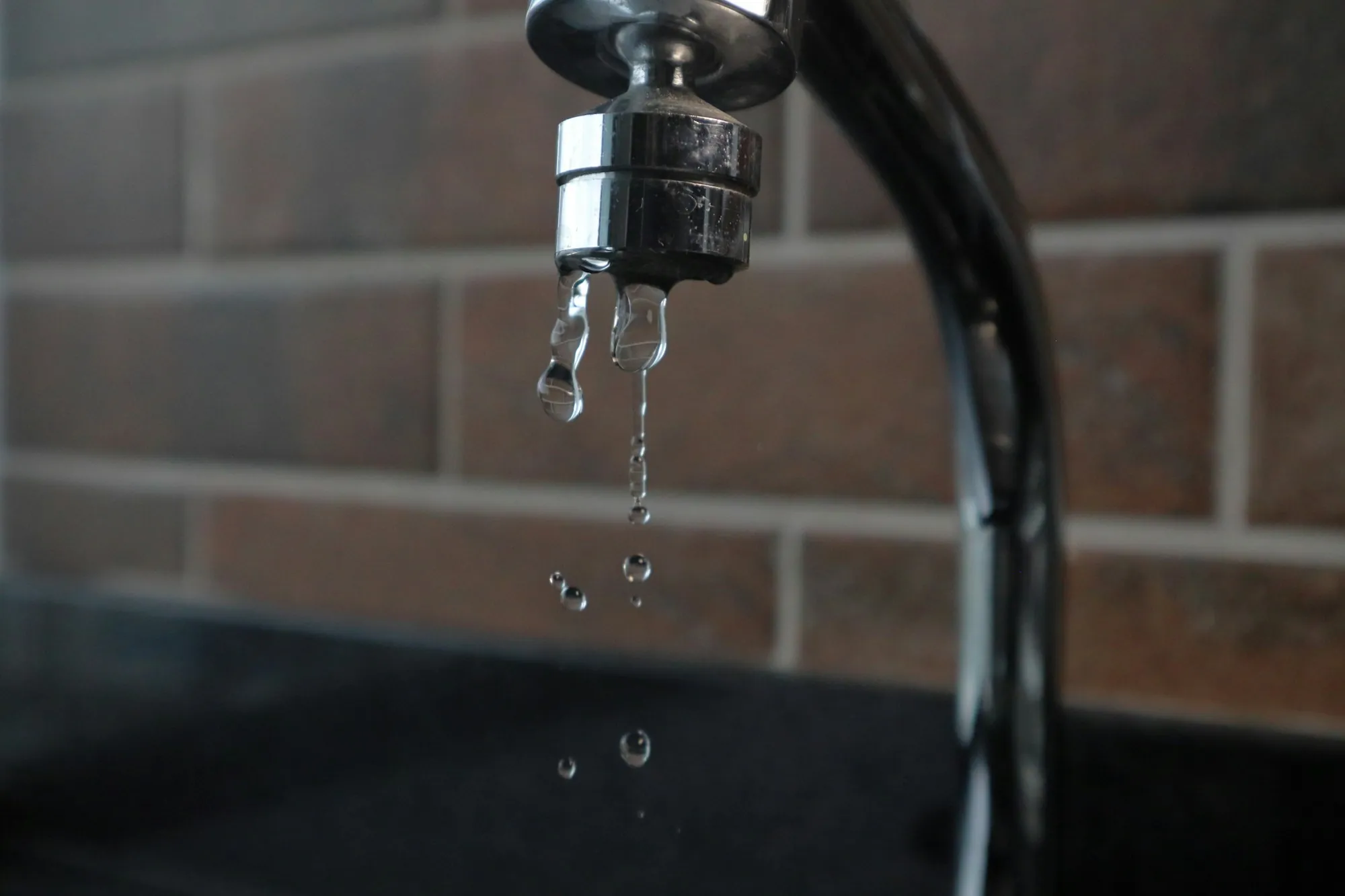 Water dripping from a kitchen faucet